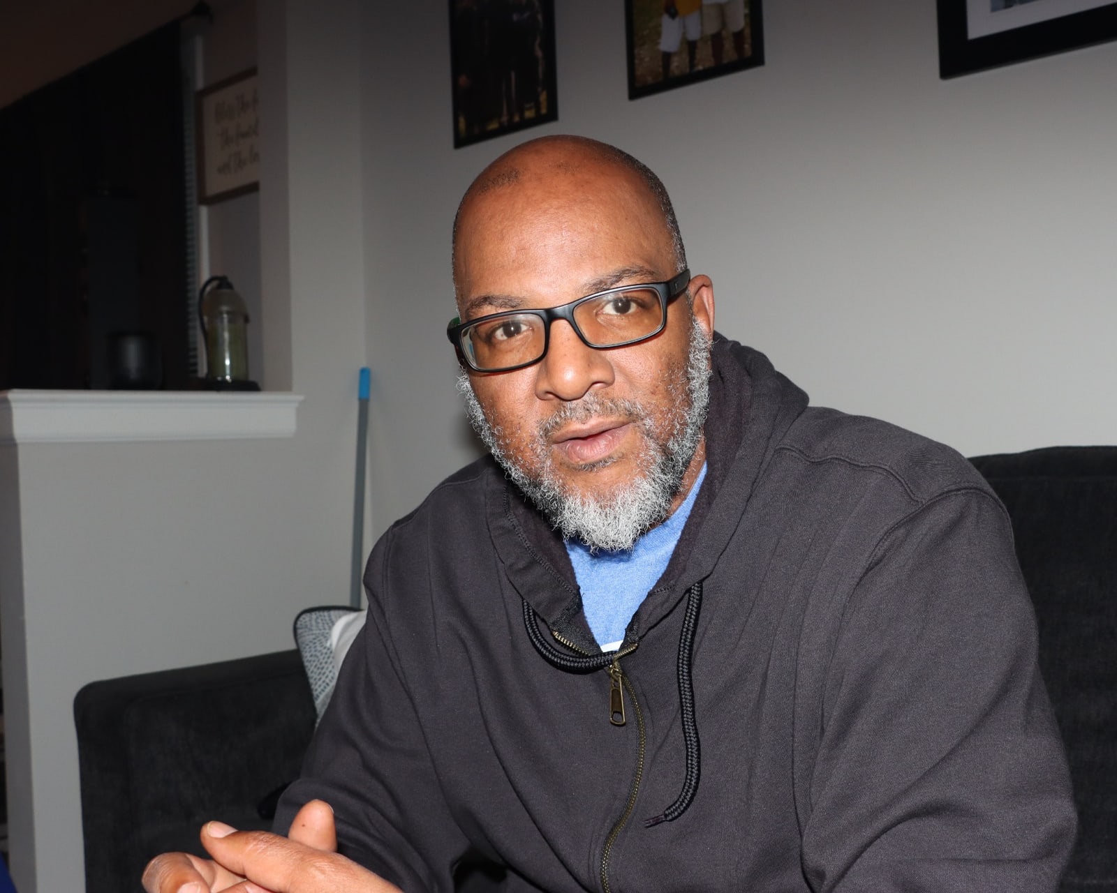 Marcus Davis seated indoors and looking toward the camera.