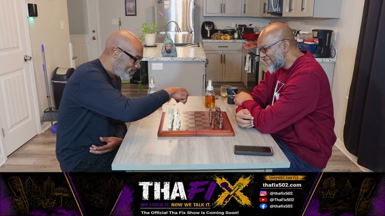 Marcus Davis and Jon Mic playing chess during a Tha Fix conversation.